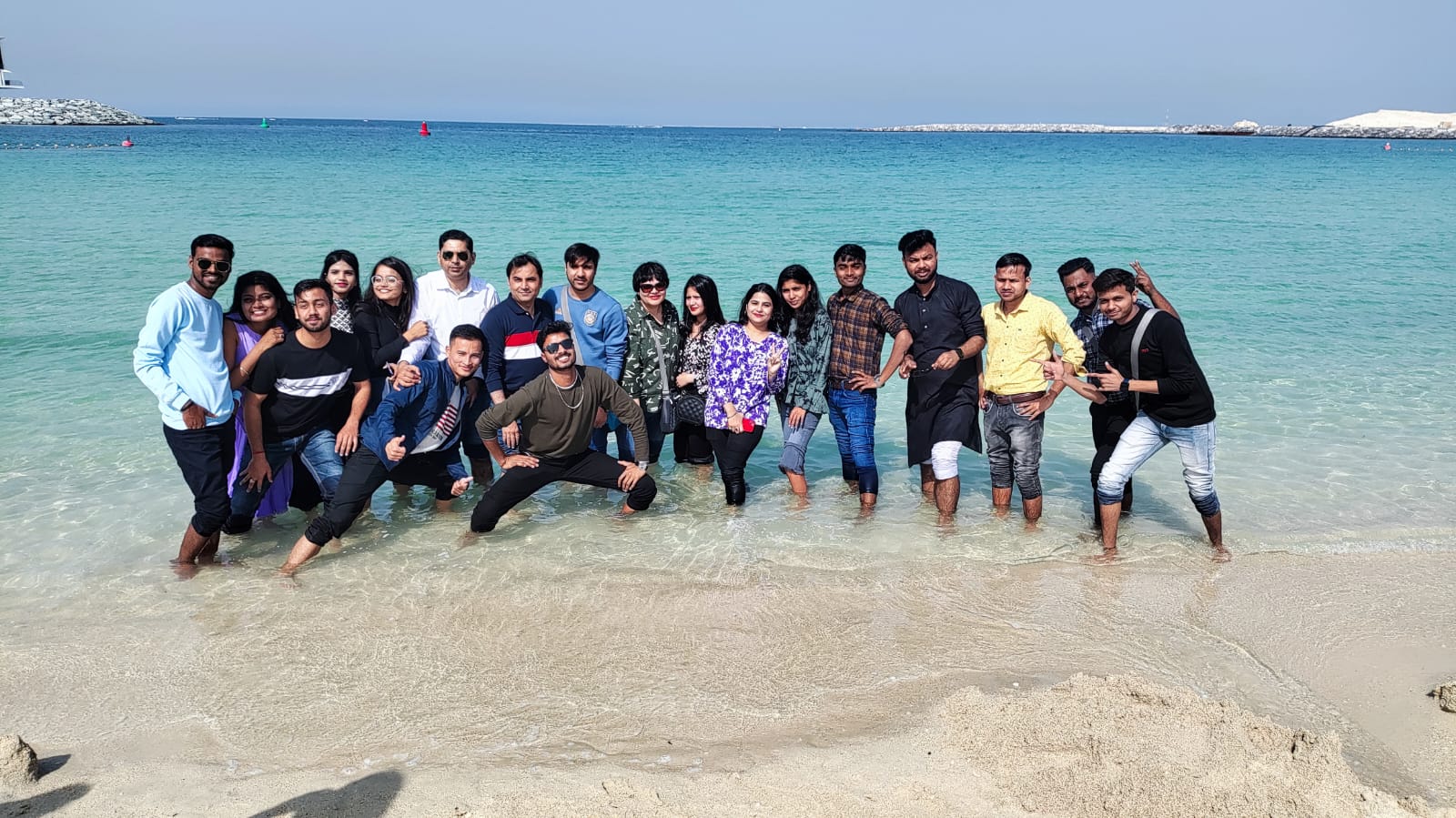 Group at Dubai beach shoreline